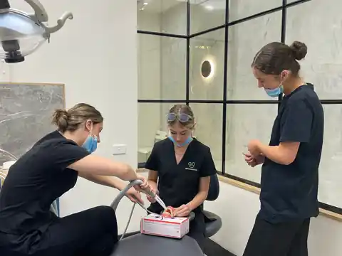 Go Orthodontics team members in clinic training