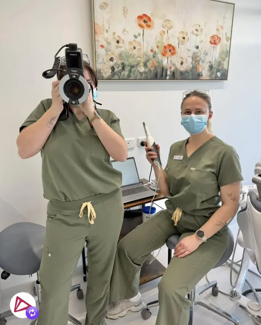 Two Go Orthodontics clinical team members with digital dental equipment