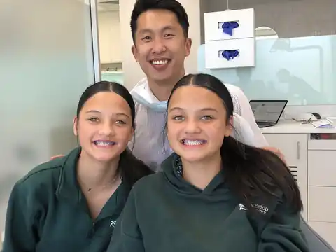 Dr Shaun Goh with two teenage patients at Go Orthodontics
